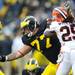 Michigan offensive linesman Taylor Lewan reaches after Illinois defenders during a field goal attempt in the third quarter at Michigan Stadium on Saturday.  Melanie Maxwell I AnnArbor.com